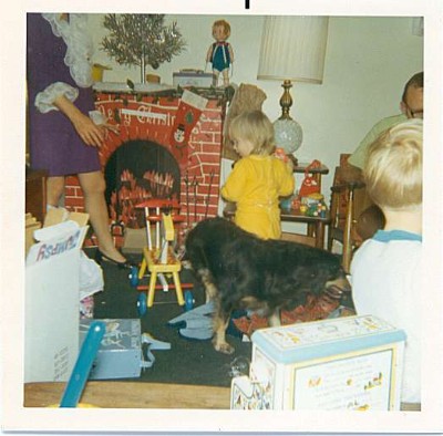 Me, our dog - Lady, and other family members near the "fireplace" - 1970